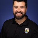 Headshot of Ty Wallin in a black U.S. Fish and Wildlife Service Polo