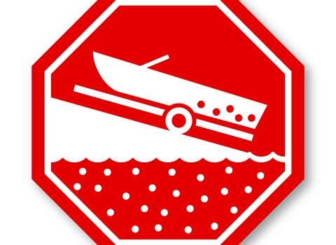 A graphic showing a red stop sign with a boat on a ramp. 