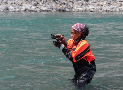 USFWS digital media intern, Typhanie Shepherd, capturing video footage of fiel