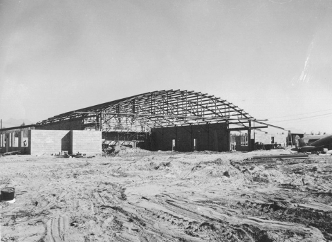 Ground level view of hangar under construction.
