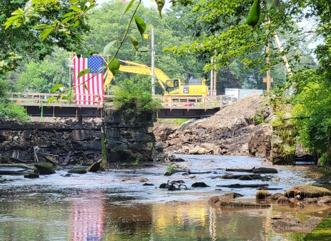 A river passes through a partially deconstructed dam