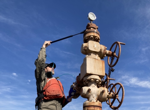 Service employee examines standing pile line. 