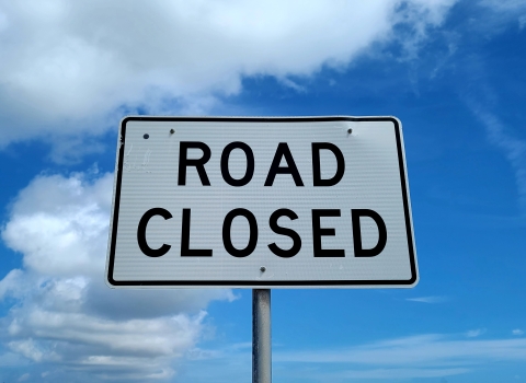A traffic sign that says, "Road Closed."