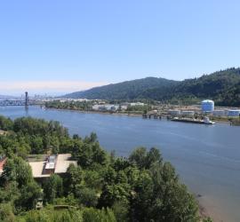View of Willamette River with railroad bridge in the background