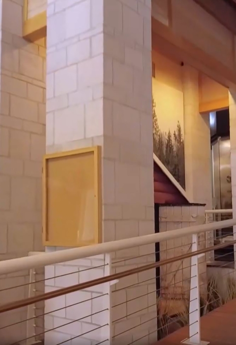 wooden walkway with rails leading into conservation museum