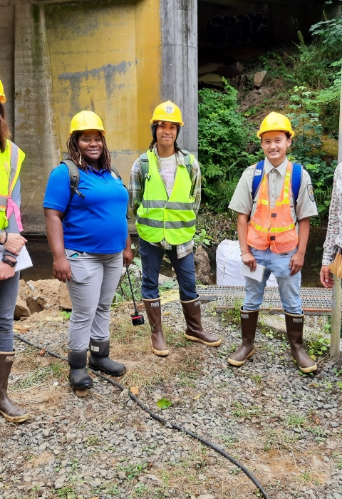 USFWS Staff and Interns standing in front of a river