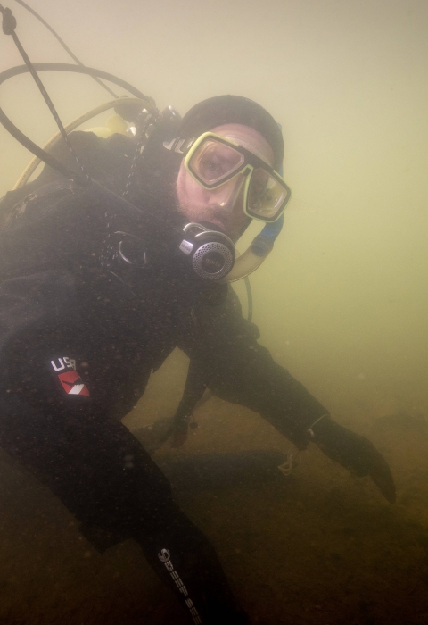 USFWS River diver surveys underwater habitat for freshwater mussels. Photo Credit: Ryan Hagerty/USFWS
