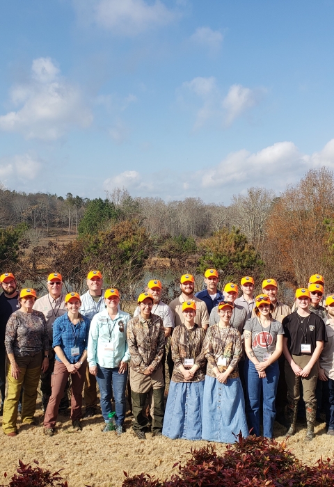 CLfT participants stand in 2 rows for group photo. 
