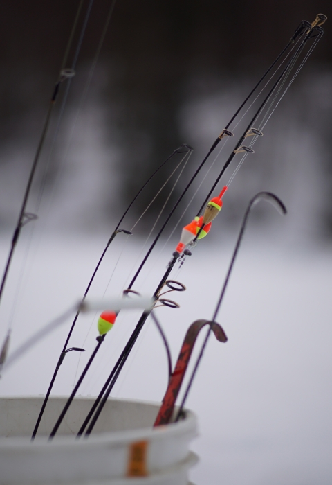 bucket of icefishing rods
