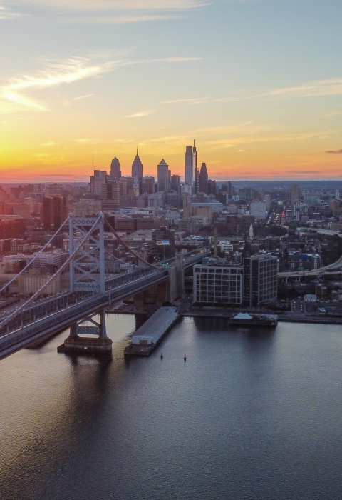 the skyline of the city of Philadelphia taken from the Delaware River with the sun 