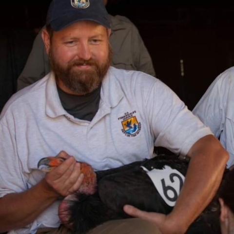 Douglass Cooper holds a California Condor. 
