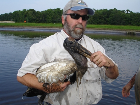 man in sunglasses holds woo stoork