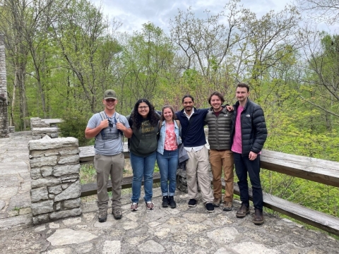 6 people outdoors in corner of viewing platform