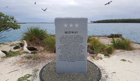 A granite monument honoring the armed forces that defended Midway from the Japanese on June 4-7, 1942