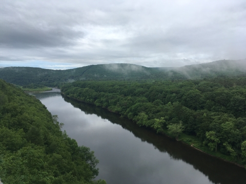 A view of a rolling hills and a river