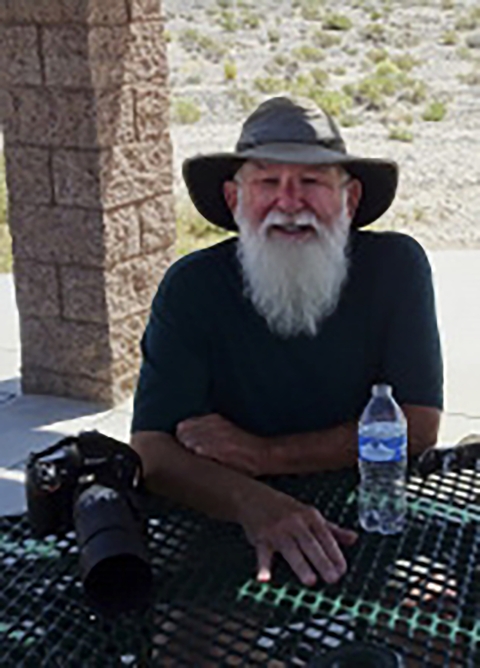 Man with white beard and hat