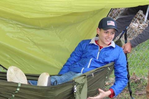 Youth enjoying learning about campsite setup