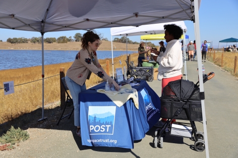 A partner booth at Flyway Trail opening on San Francisco Bay