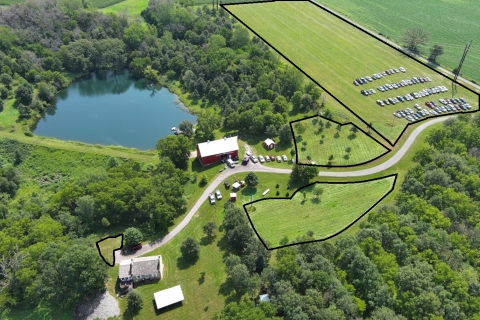 Aerial image of a farm with black shapes outlining pollinator habitat restoration locations.