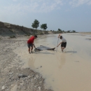 Two biologists pulling a seine in the White River, SD