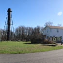 Supawna Meadows Lighthouse. The massive iron structure stands on the front lawn of our Visitor Center on a clear blue day. 