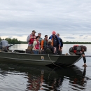 Biologist on boat sample for aquatic invasive species.
