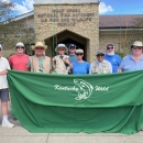 Group posing with fly fishing rods