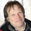 person smiling with brown hair