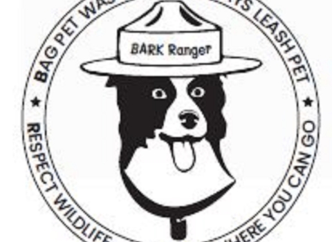 Cartoon dog with hat that says "BARK Ranger" and the words "Bag pet waste. Always leash pet. Respect wildlife. Know where you can go."