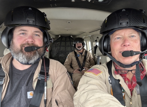 selfie of three people in an airplane
