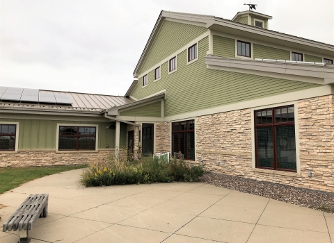 Visitor at the La Crosse District showing bird tape dots on windows
