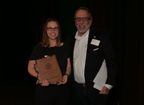 Fiscal Officer Cheryl Rodriguez holds her award from the Arizona Game and Fish Department