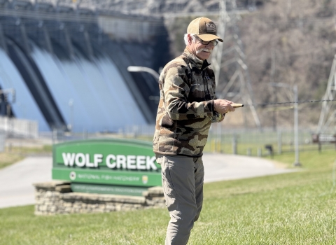 Angler practice casting fly rod