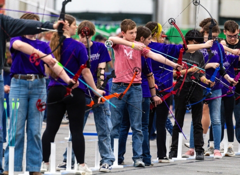 student archers on the shooting line