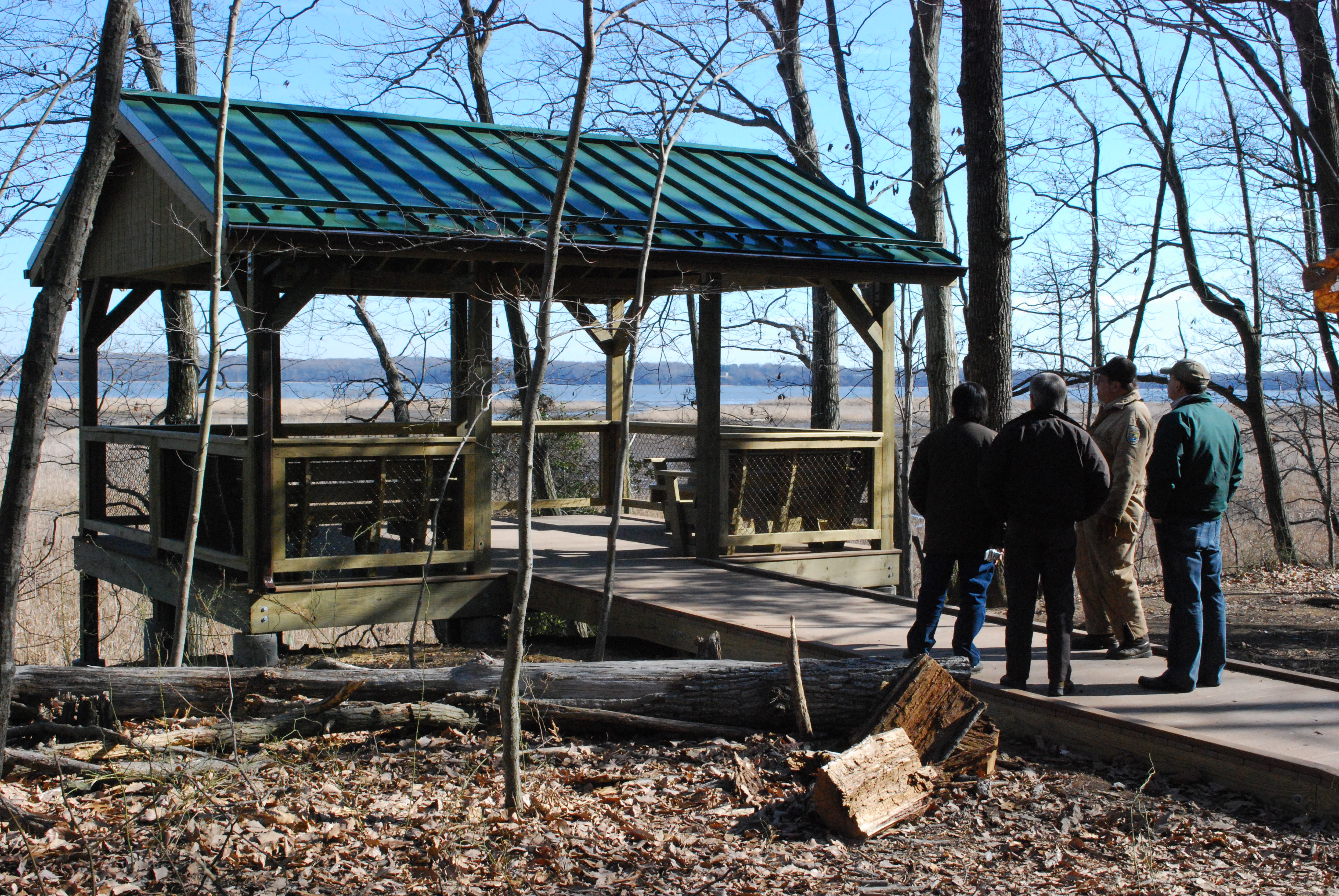 A group of four admires the newly built overlook at Mason Neck National Wildlife Refuge.