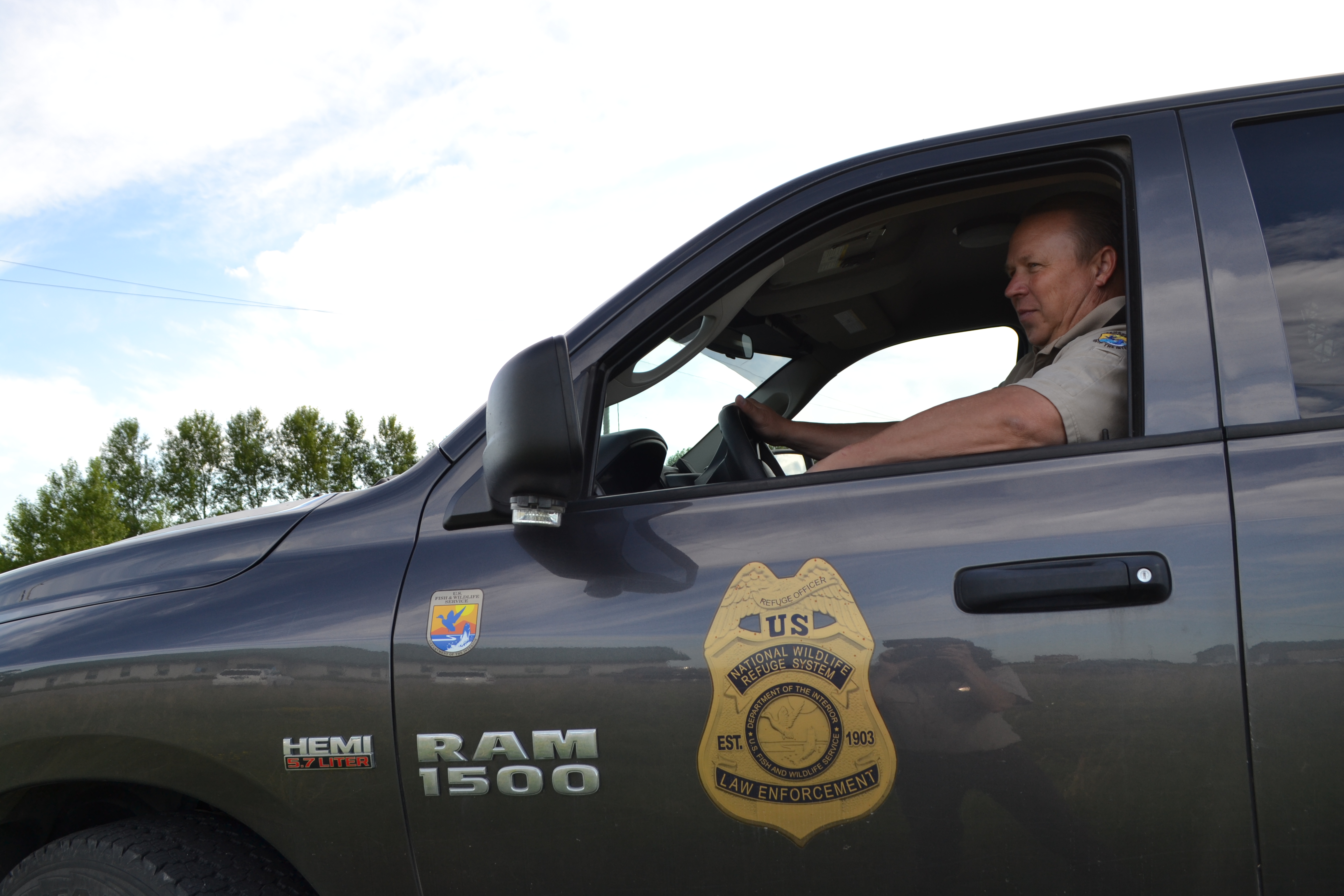 USFWS law enforcement officer sitting in truck