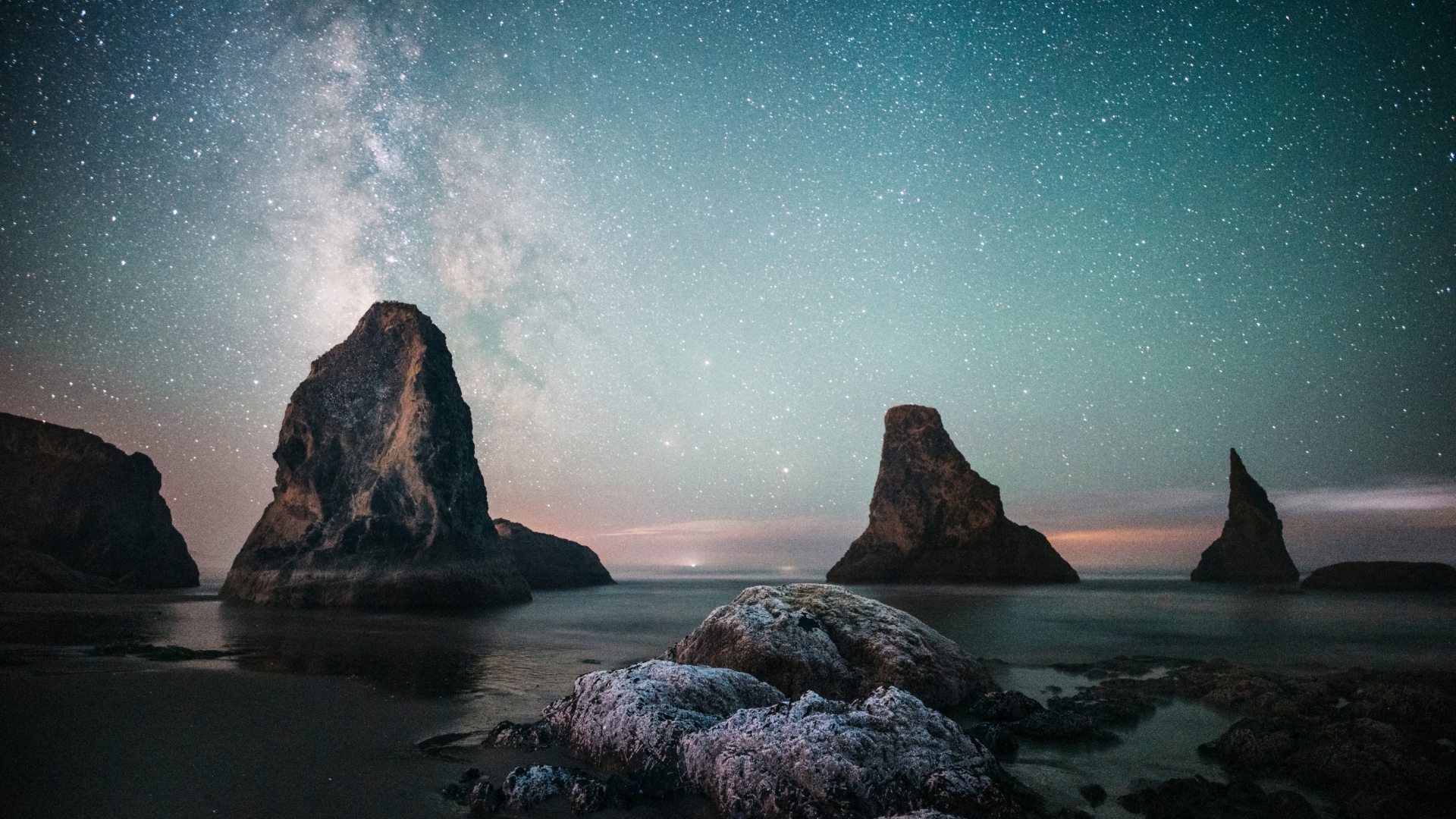 Starry night skies over the jutting rocks of Oregon Islands National Wildlife Refuge