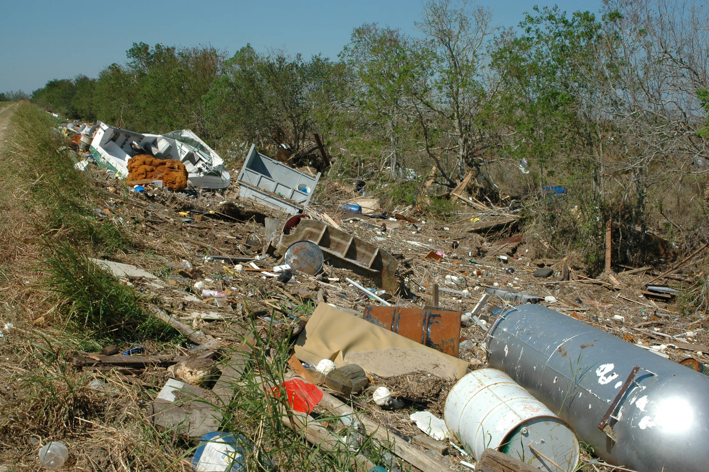 Debris scattered along the edge of a levee