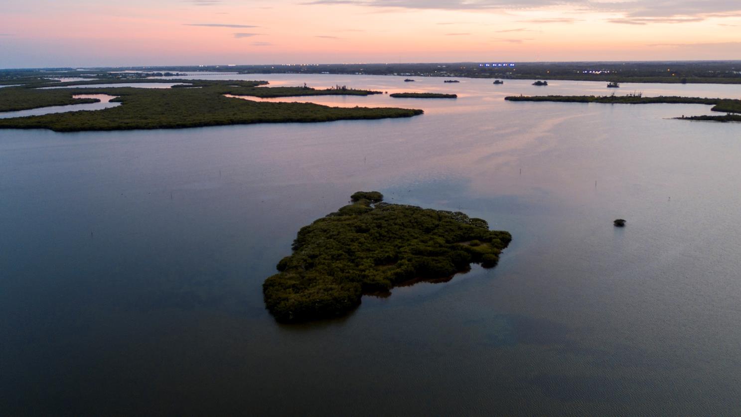 An aerial image of Pelican Island at sunset.