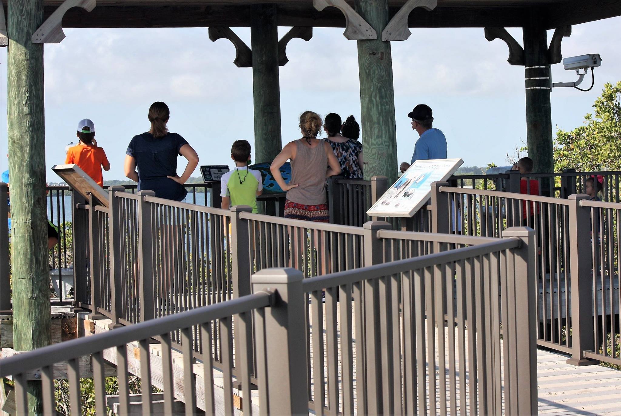 Visitors looing off a observation deck.