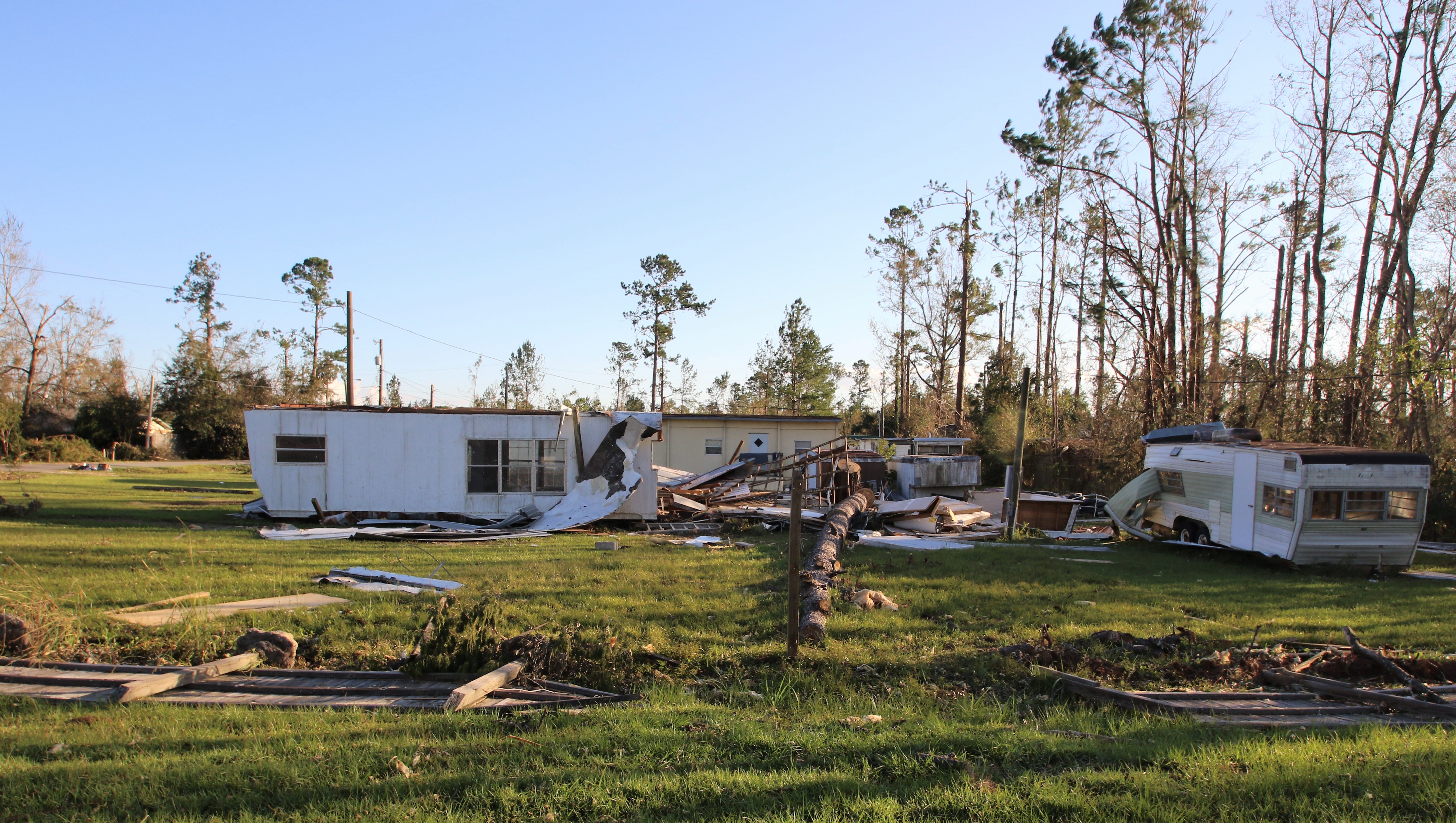 Down tress and damaged homes caused by winds from Hurricane Michael.