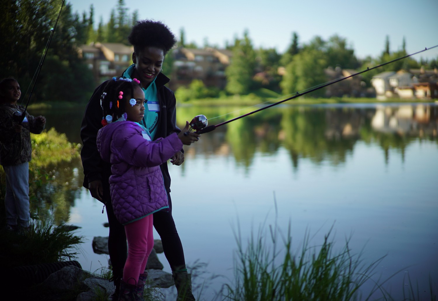 Kids fishing at a lake