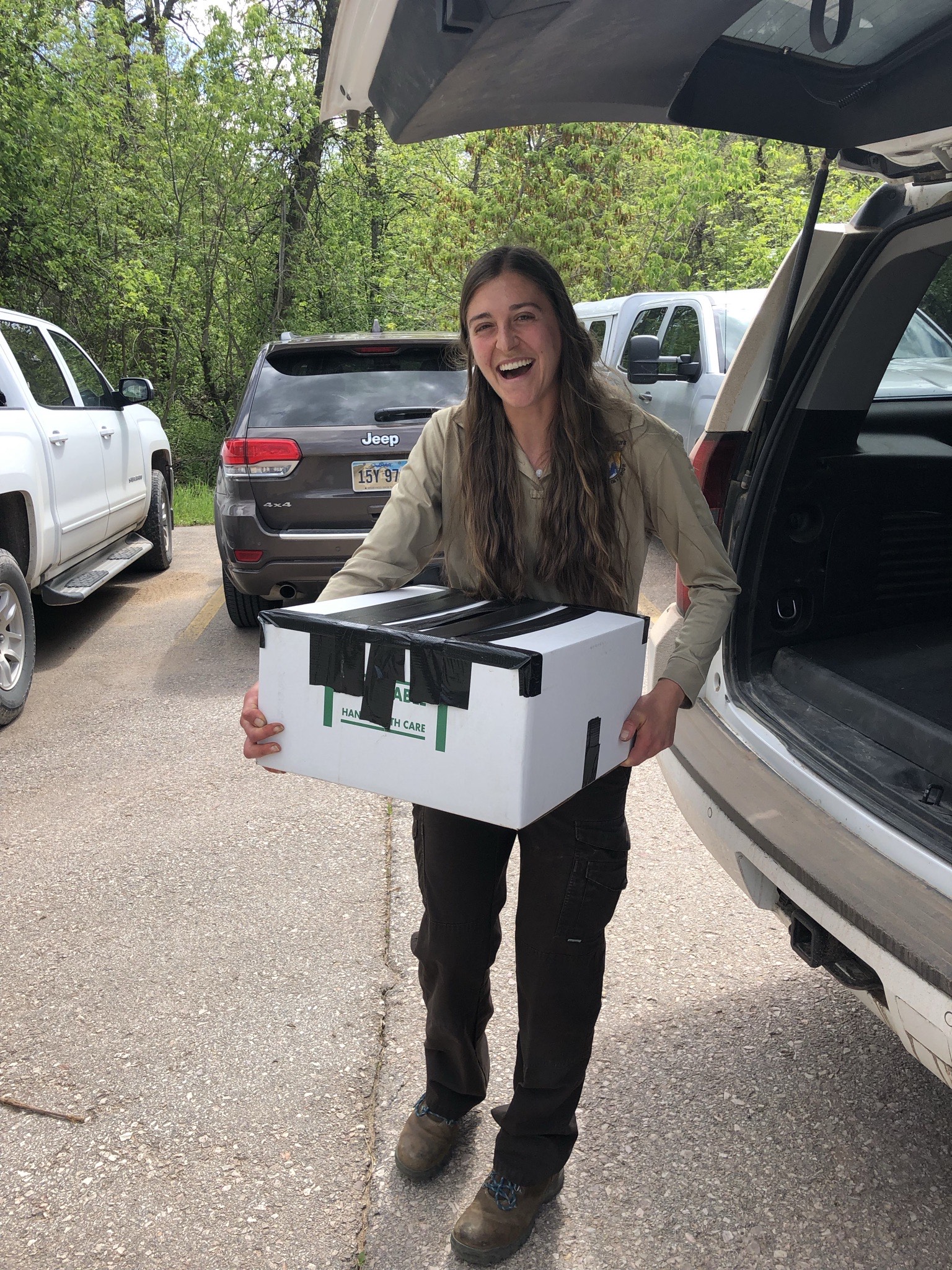 Transferring box of 15 Warm Springs dace into a vehicle FWS.gov