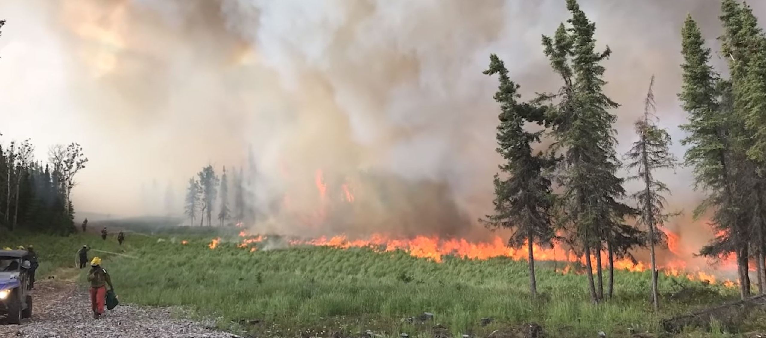 Firefighters work to contain the Swan Lake Fire in Alaska in 2019.