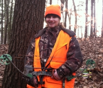 alyssa with hunting clothes and bow