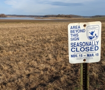 Seasonal area closed sign in front of a sanctuary area of refuge.