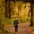 a man walking through a forest