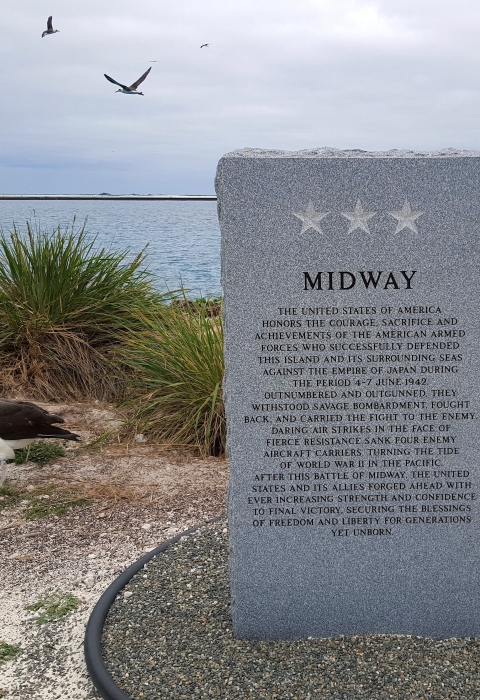 A granite monument honoring the armed forces that defended Midway from the Japanese on June 4-7, 1942