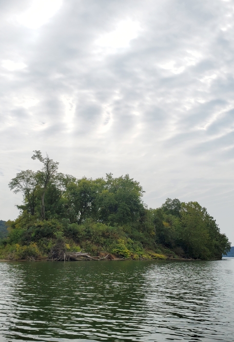 Grandview Island with dramatic clouds overhead