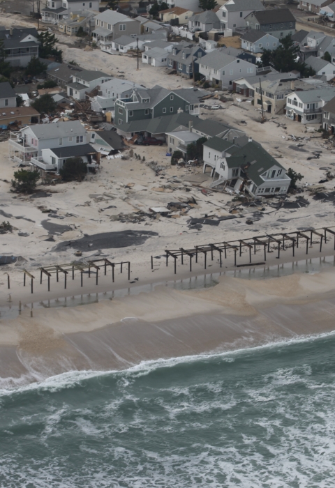 Aerial photo of damaged homes along New Jersey shore.